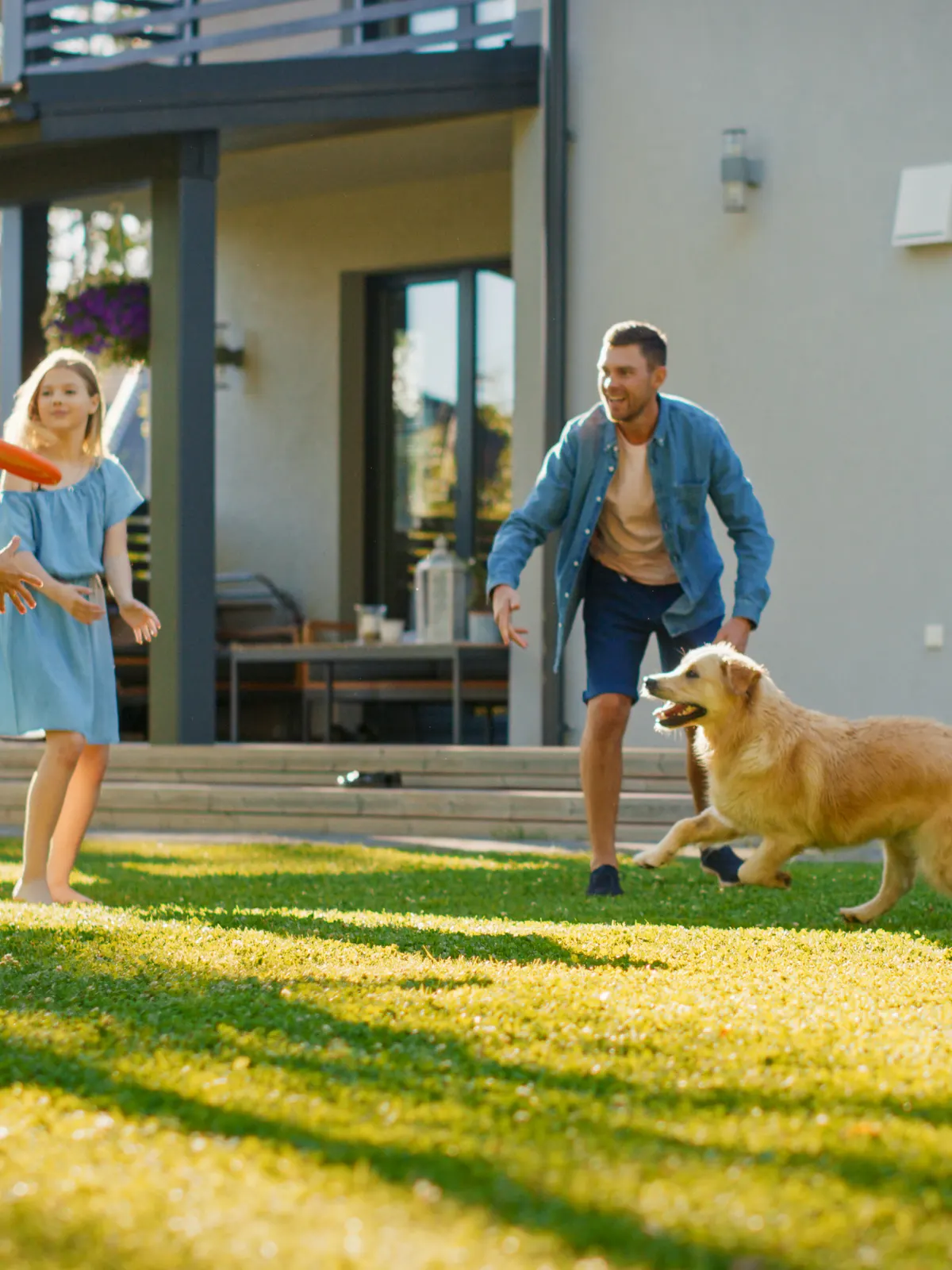 Family enjoying their clean backyard with their dog